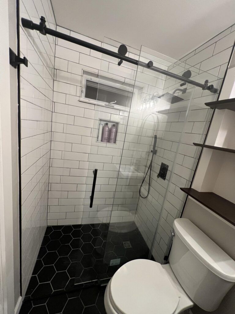 Tile Bathroom Remodel with Glass Barn Door